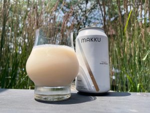 Glass and bottle of Makgeolli at Miss Kim
