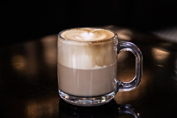 side view of a cappuccino in a glass mug