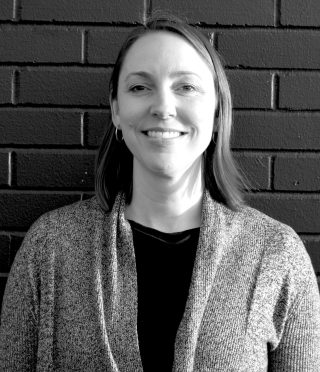 a black and white headshot of Lisa Schultz