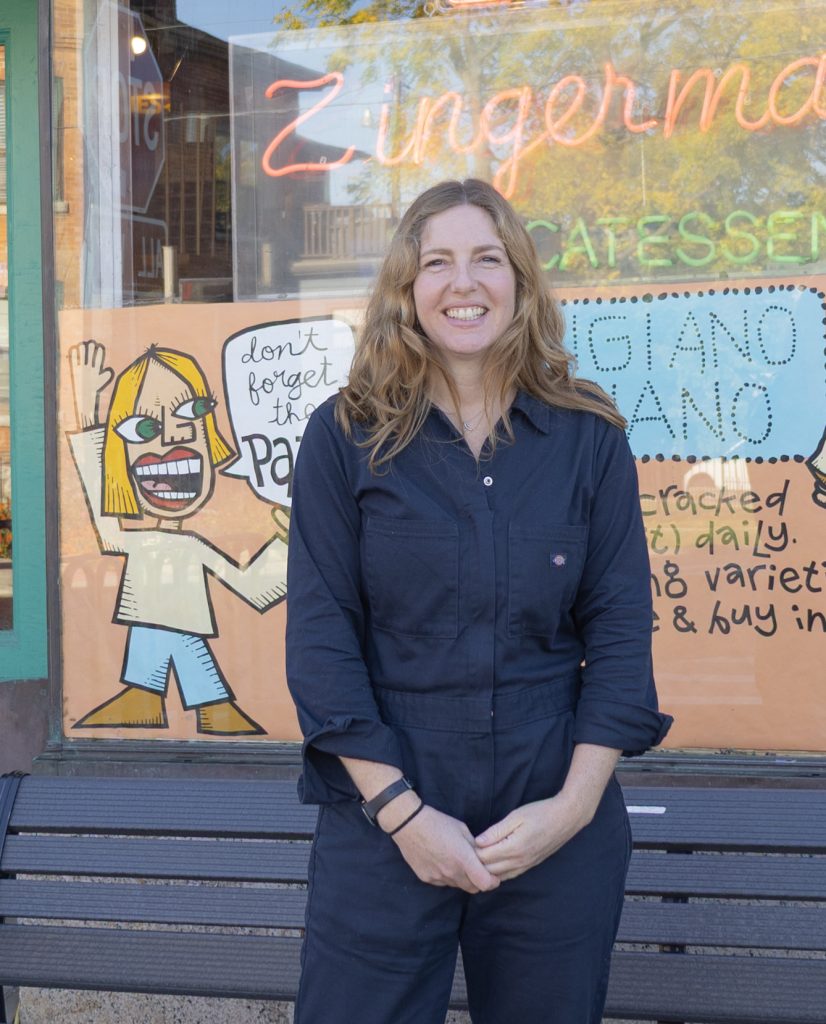 Abra Berens standing in front of Zingerman's Delicatessen