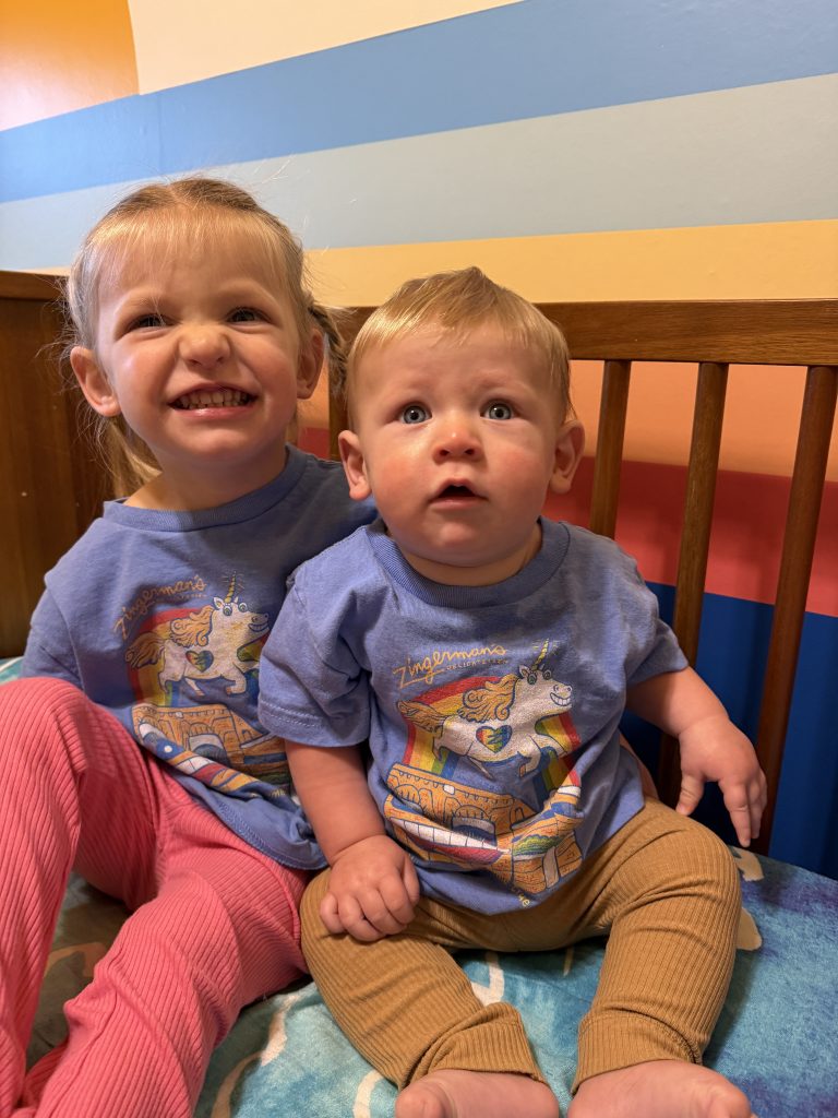 two little kids wearing Zingerman's Delicatessen t-shirts