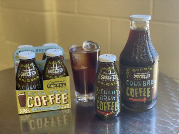 Coffee Company Cold Brew Coffee in 5 small bottles, one large bottle, and a glass with ice