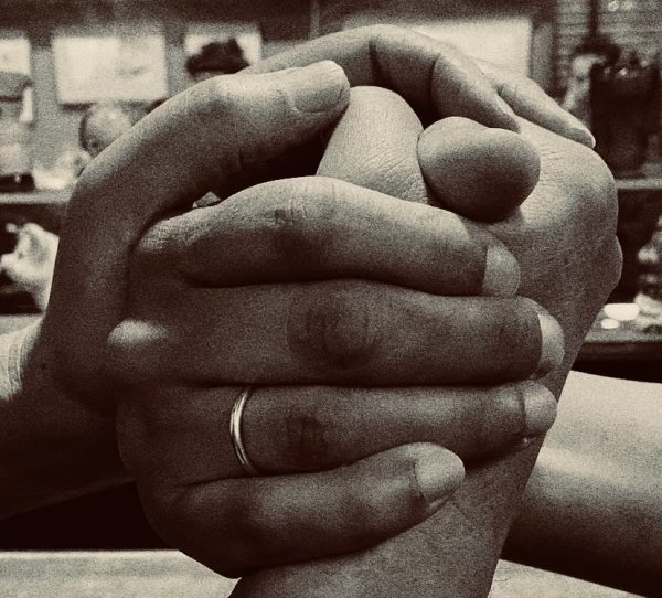 a black and white photo of two hands clasped together for the perpetual purpose trust article