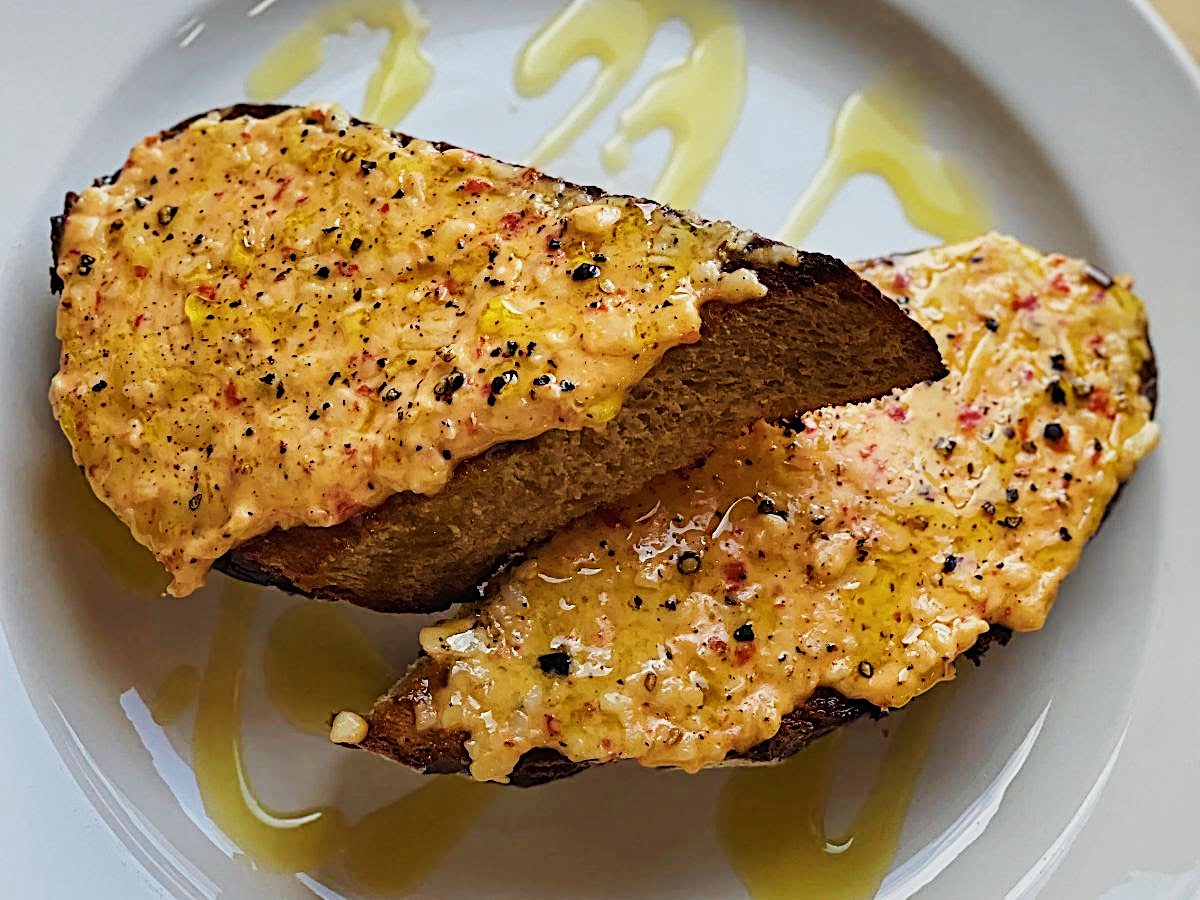 Totally tasty toast with pimento cheese, black pepper, and olive oil!
